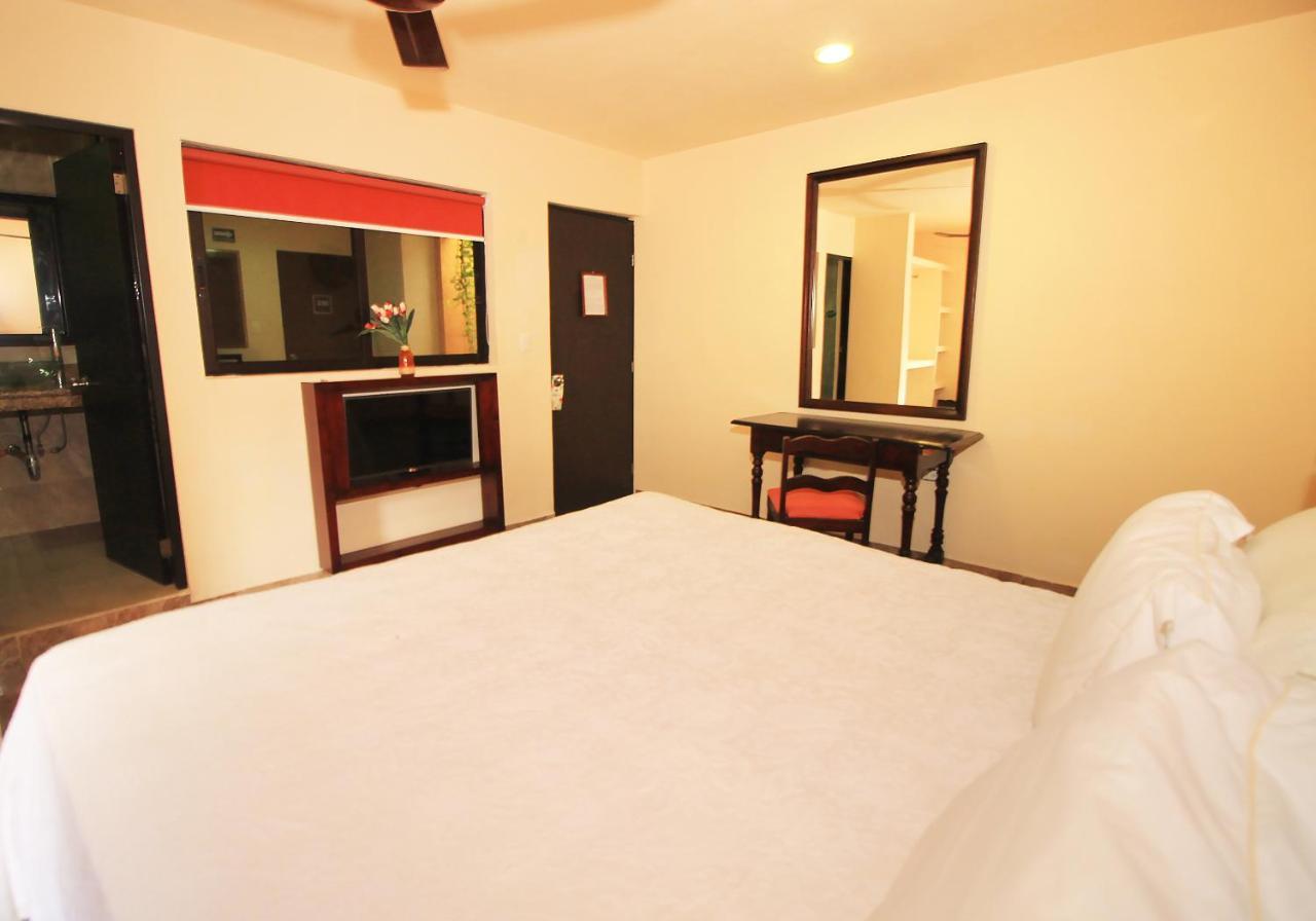 Papagayo Hotel Boutique Playa del Carmen Extérieur photo A room at the hotel